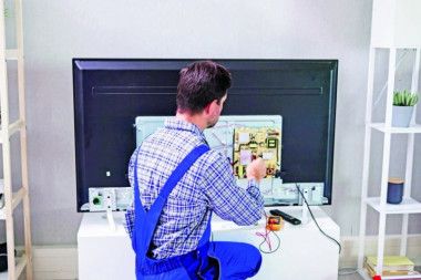 Certified Sony technician repairing TV